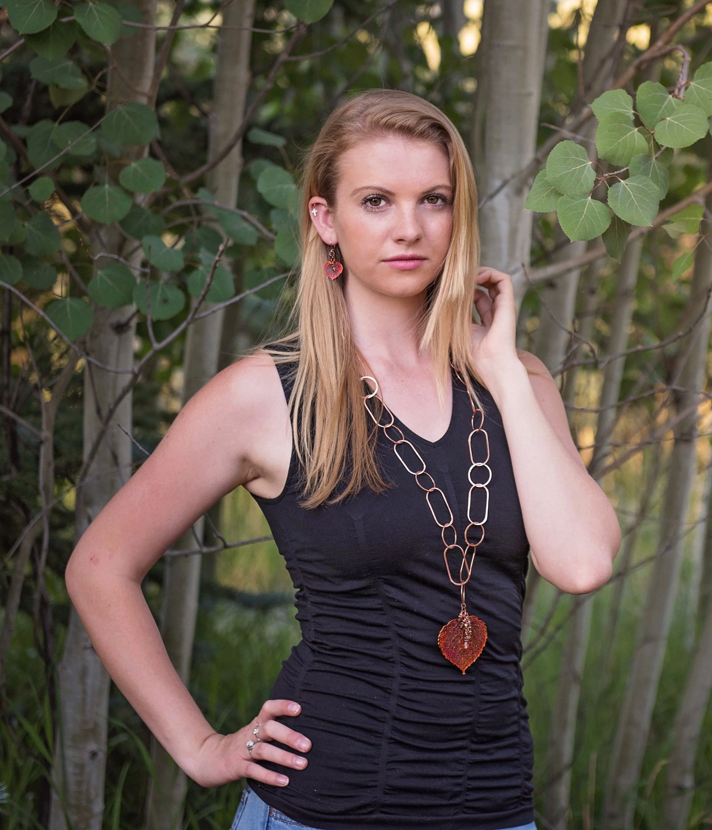 Signature Copper chain combined with a large Copper leaf and crystal dangles creates this striking necklace