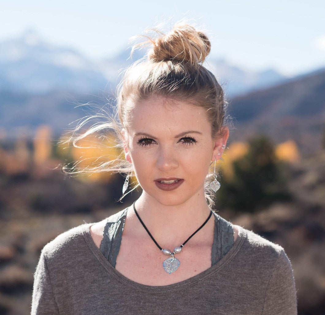 Three pearls choker: Bronze pearls with a gold leaf, come together with brown leather for this trendy versatile necklace