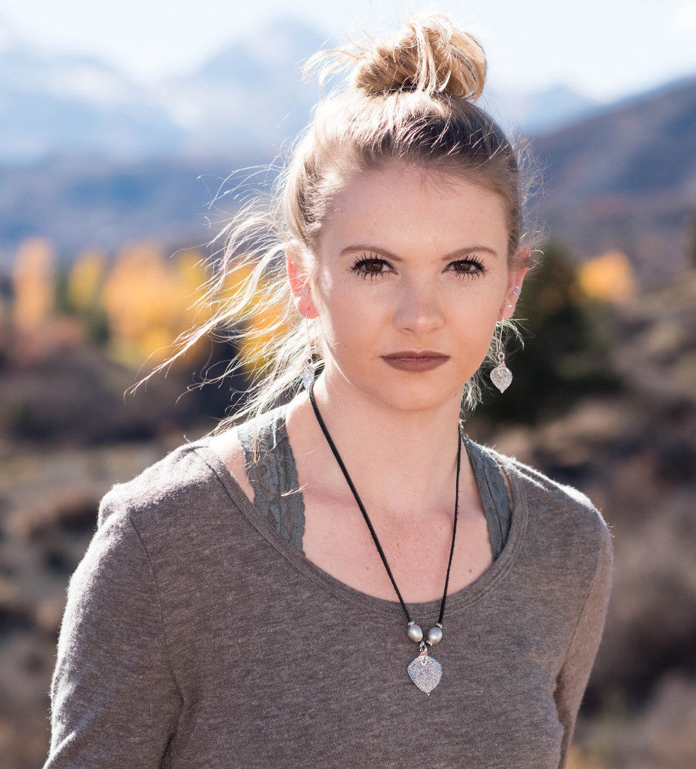 Three pearls choker: Bronze pearls with a gold leaf, come together with brown leather for this trendy versatile necklace
