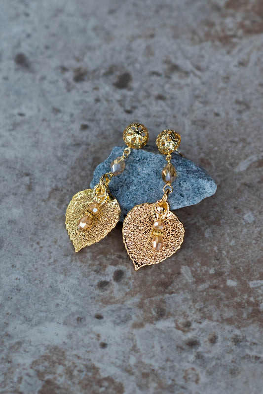 Gold earrings:  Gold  leaves with  a delicate lace post