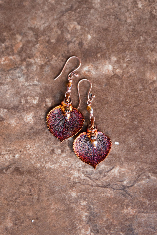 Copper earrings:  Copper leaves, Finished with crystal dangles  Connected to a traditional fishhook